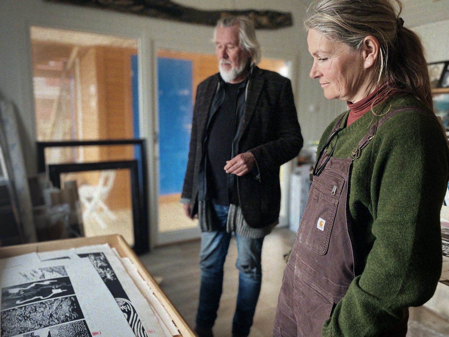 Looking over printmaking proofs in the studio at The Arctic Hideaway.