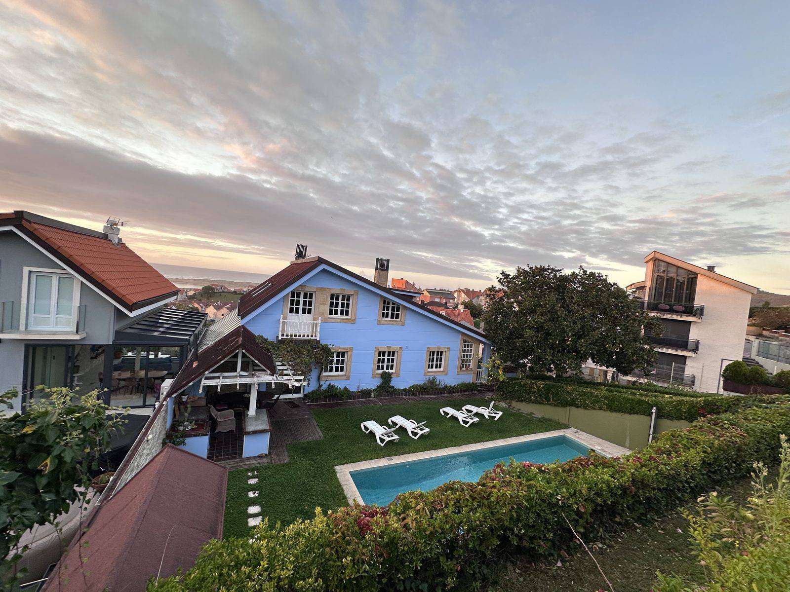 Casa Azul, its garden and pool at dusk.